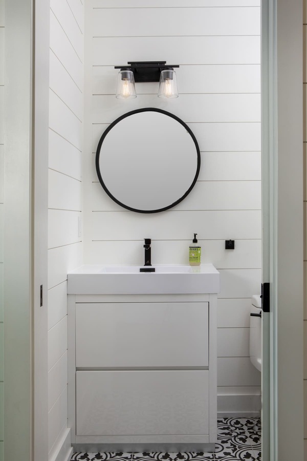 bathroom white vanity with storage, white walls | Ballantyne Builds