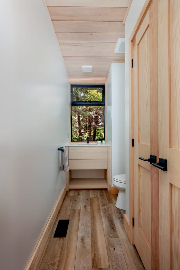 Custom bathroom, white walls, storage closet | Ballantyne Builds