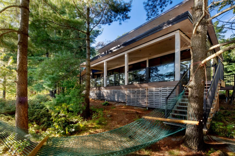 relaxing exterior with deck and hammock | Ballantyne Builds