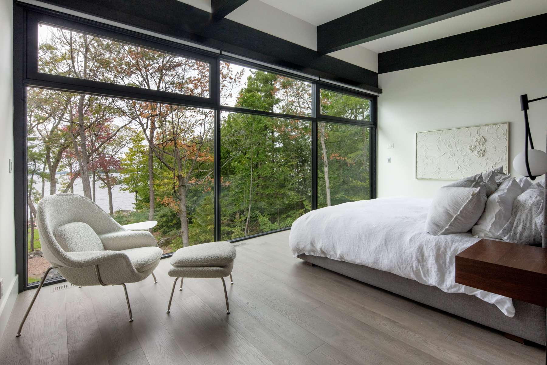Bedroom with floor to ceiling windows | Ballantyne Builds