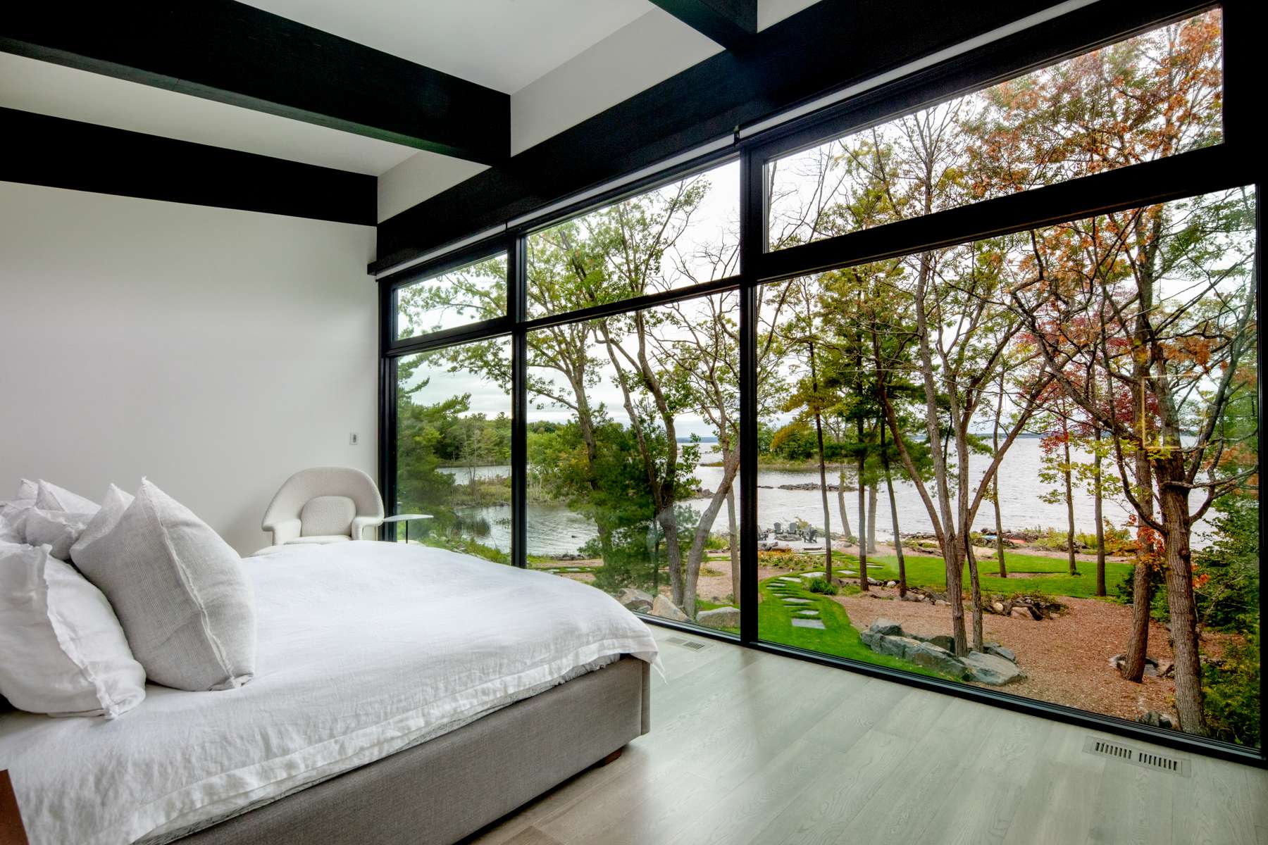Bedroom with floor to ceiling windows  | Ballantyne Builds